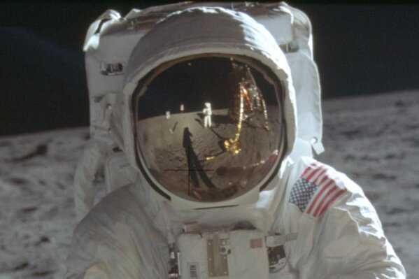 This detail of a July 20, 1969 photo made available by NASA shows astronaut Neil Armstrong reflected in the helmet visor of Buzz Aldrin on the surface of the moon. The astronauts had a camera mount...