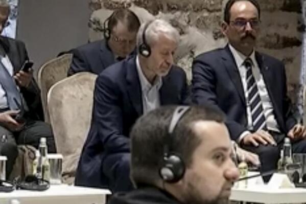 In this image taken from a video provided by the Turkish Presidency, Russian Roman Abramovich, center, listens to Turkish President Recep Tayyip Erdogan during the Russian and Ukrainian delegations meeting for talks in Istanbul, Turkey, Tuesday, March 29, 2022. Erdogan called for a cease-fire as the Russian and Ukrainian delegations resumed their two days of talks in Istanbul. (Turkish Presidency via AP)