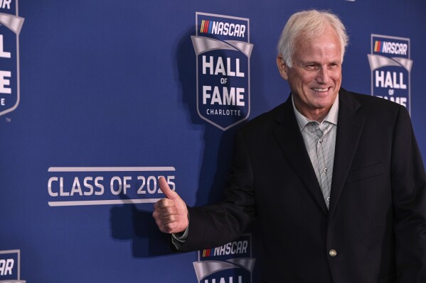Former driver Ricky Rudd poses for a photo after learning of his induction to the 2025 NASCAR Hall of Fame, Tuesday, May 21, 2024, in Charlotte, N.C. (AP Photo/Matt Kelley)