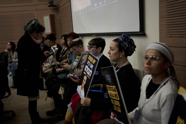 Relatives and supporters of Israelis held hostage by Hamas attend a committee hearing at the Knesset, Israel's parliament, in Jerusalem, Monday, Feb. 5, 2024. Across Israel, the chants of 