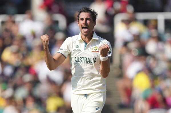 Australia's Mitchell Starc celebrates the dismissal of South Africa's Ryan Rickelton during the World Test Championship final between South Africa and Australia at Lord's cricket ground in London, Wednesday, June 11, 2025. (AP Photo/Kirsty Wigglesworth)