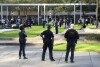 Houston Police officers watch over displaced churchgoers outside Lakewood Church, Sunday, Feb. 11, 2024, in Houston, after a reported shooting during a Spanish church service. (Karen Warren/Houston Chronicle via 番茄直播)