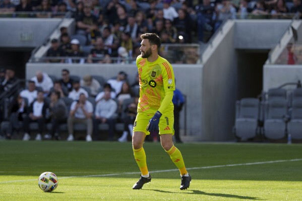 Los Angeles FC goalkeeper Hugo Lloris looks downfield before kicking the ball during the second half of the team's MLS soccer match against the Seattle Sounders, Saturday, Feb. 24, 2024, in Los Angeles. (AP Photo/Eric Thayer)