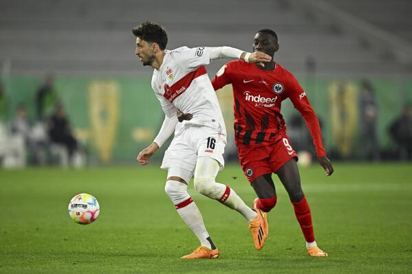 Stuttgart's Atakan Karazor, left, and Frankfurt's Randal Kolo Muani battle for the ball during the German Soccer Cup semifinal match between VfB Stuttgart and Eintracht Frankfurt at Mercedes-Benz Arena, Stuttgart, Germany, Wednesday May 3, 2023. (Tom Weller/dpa via AP)