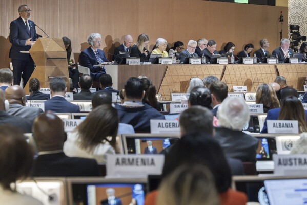 Director General of the World Health Organization (WHO) Tedros Adhanom Ghebreyesus, left, delivers his statement, during the opening of the 78th World Health Assembly at the European headquarters of the United Nations in Geneva, Switzerland, Monday, May 19, 2025. (Magali Girardin/Keystone via AP)