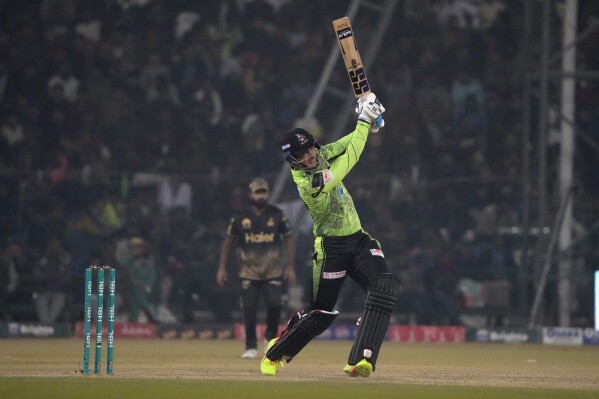 Lahore Qalandars' Rassie van der Dussen plays a shot during the Pakistan Super League T20 cricket match between Lahore Qalandars and Peshawar Zalmi, in Lahore, Pakistan, Sunday, Feb. 25, 2024. (AP Photo/K.M. Chaudary)