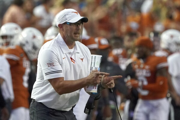 nam FILE - Then-Texas head coach Tom Herman shouts to his team during the first half of an NCAA college football game against UTEP in Austin, Texas, Sept. 12, 2020. Tom Herman was away from the college football sideline for two years before he realized that he had to get back. Florida Atlantic called at the right time. Herman is taking over in Boca Raton and now leads an Owls program that is seeking to return to the level it was at during Lane Kiffin's wildly successful stay at the school. Herman has never had a losing season as a head coach.(AP Photo/Chuck Burton, File)