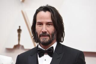 FILE - Keanu Reeves appears at the Oscars in Los Angeles on Feb. 9, 2020. Reeves will star in a TV adaptation of “The Devil in the White City.” The nonfiction thriller about ambition, a killer and the 1893 World’s Fair in Chicago was written by Erik Larson. The Hulu streaming service says that Reeves will portray Daniel H. Burnham, an architect who helped design the fair. (Photo by Jordan Strauss/Invision/AP, File)