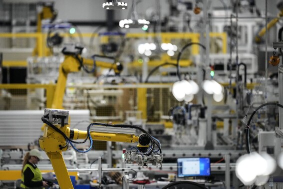 FILE - Articulated robots move inside the Hanwha Qcells Solar plant, Oct. 16, 2023, in Dalton, Ga. On Thursday, April 25, 2024, the U.S. government issues the first of three estimates of economic growth in the first quarter. (AP Photo/Mike Stewart, File)