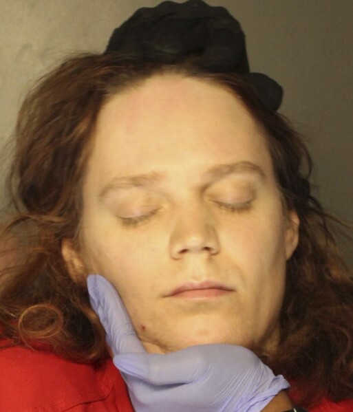 In this Jan., 2023 booking photo provided by the Delaware County, Pennsylvania, District Attorney's Office, Jack LaSota refused to speak and kept her eyes closed while being photographed after being detained in a hotel in suburban Pennsylvania on Jan. 23, 2023. (Delaware County, Pennsylvania, District Attorney's Office via AP)