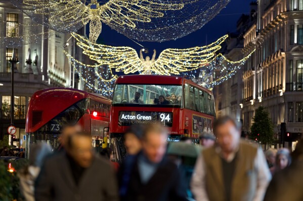 FILE - Christmas lights are displayed on Regent Street in London on Nov. 24, 2022. The rate of inflation in the U.K. fell sharply in July to a 17-month low largely on the back of lower energy prices, official figures showed Wednesday, Aug. 16, 2023, a welcome development for hard-pressed households struggling during the cost of living crisis. (AP Photo/Kin Cheung, File)
