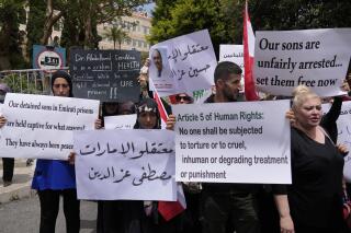 FILE - Relatives and supporters of Lebanese citizens detained in the United Arab Emirates protest in front of the Foreign Ministry headquarters demanding the release of the detainees, in downtown Beirut, Lebanon, Monday, May 15, 2023. Lebanon's foreign ministry said Saturday, May 27, a group of Lebanese citizens detained in the United Arab Emirates have been released. (AP Photo/Hussein Malla, File)