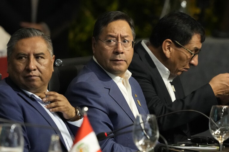 Bolivia's President Luis Arce, center, attends the Amazon Summit at the Hangar Convention Center in Belem, Brazil, Tuesday, Aug. 8, 2023. (AP Photo/Eraldo Peres)