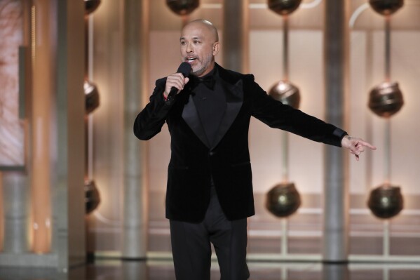 This image released by CBS shows host Jo Koy during the 81st Annual Golden Globe Awards in Beverly Hills, Calif., on Sunday, Jan. 7, 2024. (Sonja Flemming/CBS via AP)