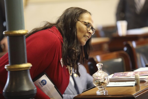 South Carolina Sen. Margie Bright Matthews, D-Walterboro, talks to a fellow senator on Tuesday, Feb. 27, 2024 in Columbia, South Carolina. (AP Photo/Jeffrey Collins)
