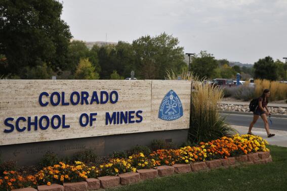 In this Oct. 2, 2015 photo, a student walks past the entrance to the Colorado School of Mines, a public research university devoted to engineering and applied science, in Golden, Colo. Quarterback John Matocha, who has led Colorado School of Mines to the Division II championship game, leads The Associated Press D-II All-America team. Matocha has passed for 4,558 yards and 50 touchdowns with only six interceptions for the Orediggers (13-2), who face Ferris State in the title game Saturday, Dec. 17, 2022. (AP Photo/Brennan Linsley)