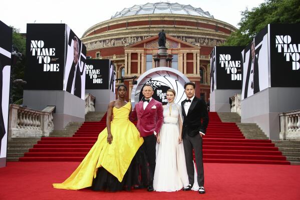 Lashana Lynch, from left, Daniel Craig, Lea Seydoux and Cary Joji Fukunaga pose for photographers upon arrival for the World premiere of the new film from the James Bond franchise 'No Time To Die', in London Tuesday, Sept. 28, 2021. (Photo by Joel C Ryan/Invision/AP)