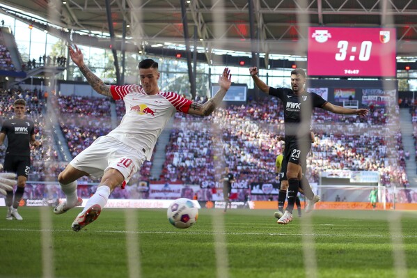 Leipzig's Benjamin Sesko fails in front of goal during the German Bundesliga soccer match between RB Leipzig and FC Augsburg at the Red Bull Arena in Leipzig, Germany, Saturday, Sept. 16, 2023. (Jan Woitas/dpa via AP)