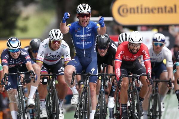 Britain's Mark Cavendish celebrates as he crosses the finish line to win the fourth stage of the Tour de France cycling race over 150.4 kilometers (93.5 miles) with start in Redon and finish in Fougeres, France, Tuesday, June 29, 2021. (Guillaume Horcajuelo, Pool Photo via AP)