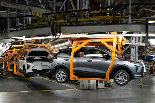 Vehicles move along the 2023 Chevrolet Bolt EV and EUV assembly line at the General Motors Orion Assembly on June 15, 2023, in Lake Orion, Mich. (AP Photo/Carlos Osorio, File)