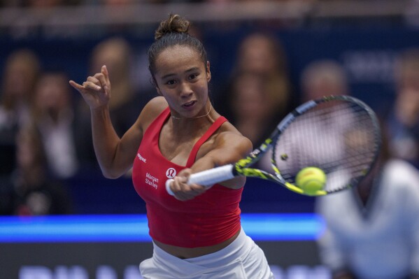 Canada's Leylah Fernandez returns the ball to Czech Republic's Marketa Vondrousova during their semifinal singles tennis match at the Billie Jean King Cup finals at La Cartuja stadium in Seville, southern Spain, Spain, Saturday, Nov. 11, 2023. (AP Photo/Manu Fernandez)