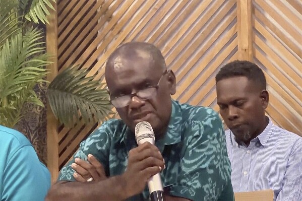 Candidate for prime minister Jeremiah Manele speaks during a news conference, Monday, April 29, 2024, in Honiara, Solomon Islands. Solomon Islands Prime Minister Manasseh Sogavare on Monday withdrew from the contest to remain head of the strategically important South Pacific island nation’s government following general elections two weeks ago that are central to the U.S.-China rivalry in the region. (Australian Broadcasting Corporation via AP)