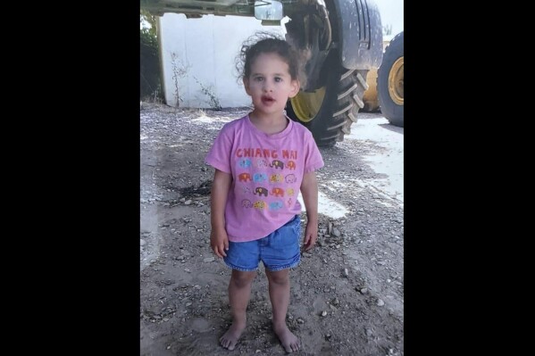 Abigail Edan is shown in this family hand out photo. Abigail Edan is just 3 years old, yet when Hamas militants stormed her kibbutz, Kfar Azza, on Oct. 7 and killed her parents, she knew enough to run to a neighbor's for shelter. The families of children held captive by Hamas say they are adrift in a unique agony among the tragedies of Israel's bloodiest day. (Tal Edan via AP)