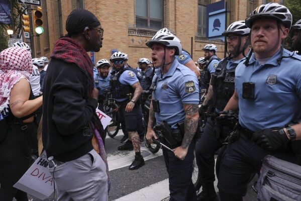 Police officers confront protestors, Saturday, June 14, 2025, in Philadelphia. (AP Photo/Yuki Iwamura)