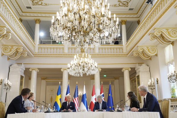 FILE - President Joe Biden speaks with Nordic leaders from left, Sweden's Prime Minister Ulf Kristersson, Denmark's Prime Minister Mette Frederiksen, Biden, Finland's President Sauli Niinisto, Iceland's Prime Minister Katrin Jakobsdottir and Norway's Prime Minister Jonas Gahr Store, at the Presidential Palace in Helsinki, Finland, July 13, 2023. (AP Photo/Susan Walsh, File)