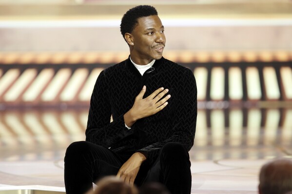 This image released by NBC shows host Jerrod Carmichael during his monologue at the 80th Annual Golden Globe Awards held at the Beverly Hilton Hotel on Tuesday, Jan. 10, 2023, in Beverly Hills, Calif. (Rich Polk/NBC via AP)