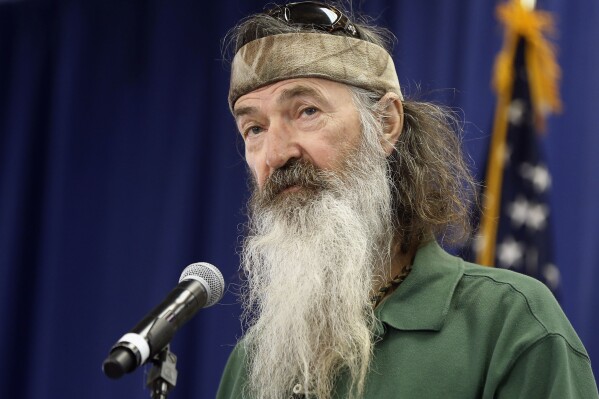 Phil Robertson of the Duck Dynasty reality television program speaks at a Republican presidential candidate, Sen. Ted Cruz, R-Texas, campaign stop, Feb. 19, 2016, in Myrtle Beach, S.C. (AP Photo/Matt Rourke, File)