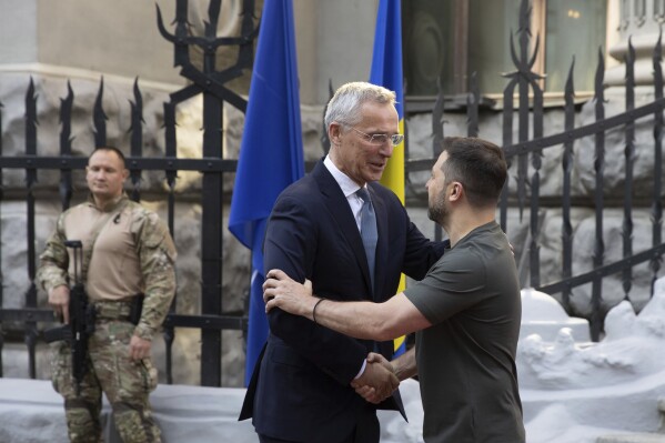 NATO Secretary General Jens Stoltenberg, left, and Ukrainian President Volodymyr Zelenskyy shake hands prior to their meeting in Kyiv, Ukraine, Thursday, Sept. 28, 2023. (Ukrainian Presidential Press Office via AP)