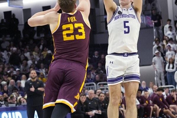Northwestern guard Ryan Langborg, right, shoots over Minnesota forward Parker Fox, left, during the second half of an NCAA college basketball game in Evanston, Ill., Saturday, March 9, 2024. (AP Photo/Nam Y. Huh)