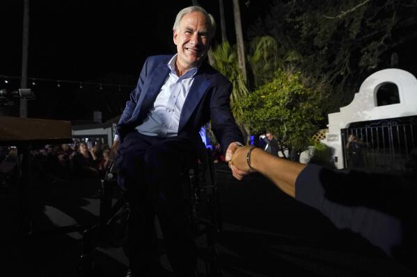 Texas Gov. Greg Abbott shakes hands with a supporter as he arrives to speak during an election night campaign event Tuesday, Nov. 8, 2022, in McAllen, Texas. (AP Photo/David J. Phillip)