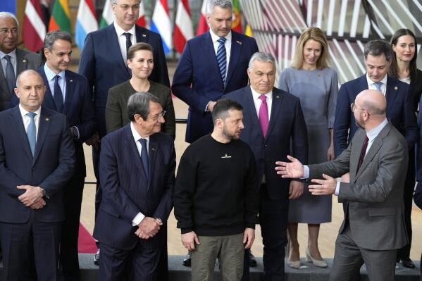 European Council President Charles Michel, front right, speaks with Ukraine's President Volodymyr Zelenskyy, front second right, and Hungary's Prime Minister Viktor Orban, second row center, as they pose with other European Union leaders for a group photo at an EU summit in Brussels on Thursday, Feb. 9, 2023. European Union leaders are meeting for an EU summit to discuss Ukraine and migration. (AP Photo/Virginia Mayo)