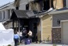 FILE - Investigators stand outside a house where five immigrants from Senegal were found dead after a fire in suburban Denver on Aug. 5, 2020. Kevin Bui pleaded guilty Friday, May 17, 2024, to a house fire that killed five members of the Senegalese family in 2020 in a case of misplaced revenge caused by mistakenly tracking his stolen iPhone to the home. (AP Photo/Thomas Peipert, File)