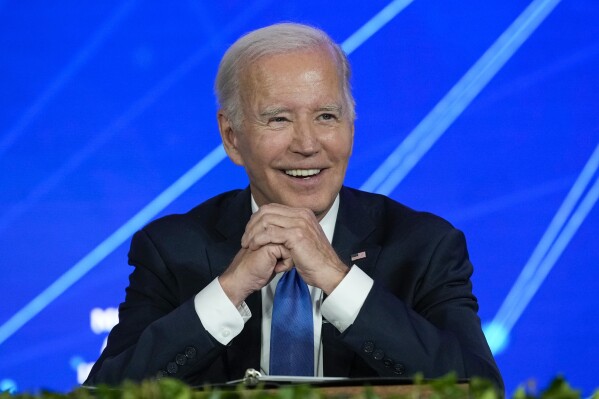 President Joe Biden smiles as members of the media leave the room and ask questions about his son Hunter Biden, during a discussion on managing the risks of Artificial Intelligence during an event in San Francisco, Tuesday, June 20, 2023. (AP Photo/Susan Walsh)