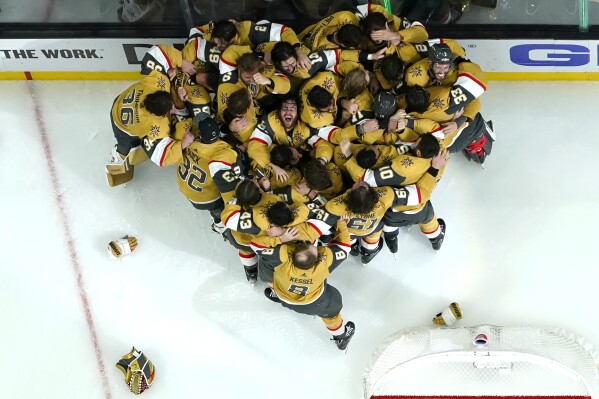 FILE - Members of the Vegas Golden Knights celebrate after they defeated the Florida Panthers 9-3 to win the Stanley Cup in Game 5 of the NHL hockey Stanley Cup Finals Tuesday, June 13, 2023, in Las Vegas. Vegas opened training camp Thursday with nearly the identical team that won the championship three months ago. (AP Photo/Abbie Parr, File)