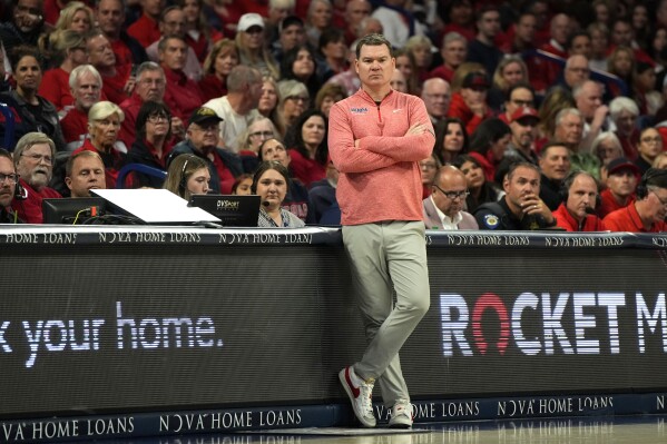 Arizona head coach Tommy Lloyd watches the action during the second half of an NCAA college basketball game against Arizona State, Saturday, Feb. 17, 2024, in Tucson, Ariz. (AP Photo/Rick Scuteri)