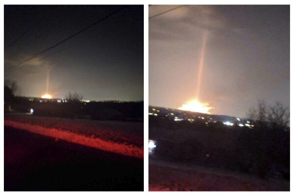 This combination of photos provided by Travis Secrest, a resident of Perry Township in Ohio, shows a flame at the Marathon Petroleum refinery in the winter of 2018. (Travis Secrest via AP)