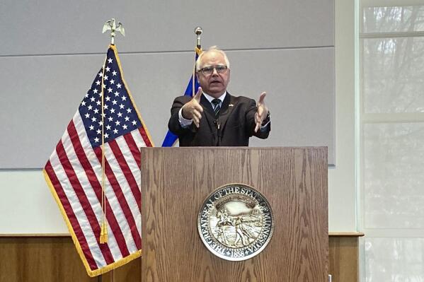 Democratic Minnesota Gov. Tim Walz delivers an update to his budget proposal at a news conference on Thursday, March 16, 2023, in St. Paul, Minn. Walz nearly doubled his request for public safety aid for cities, counties and tribal governments to $550 million, building on a budget forecast last month that showed Minnesota’s budget surplus holding relatively steady at $17.5 billion. (AP Photo/Steve Karnowski)