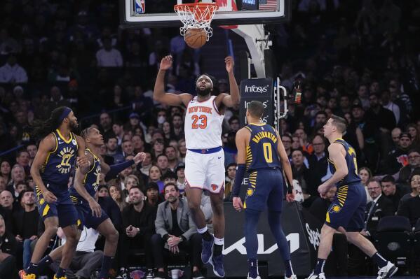 New York Knicks center Mitchell Robinson (23) dunks in the first half of an NBA basketball game against the Indiana Pacers, Wednesday, Jan. 11, 2023, at Madison Square Garden in New York. (AP Photo/Mary Altaffer)