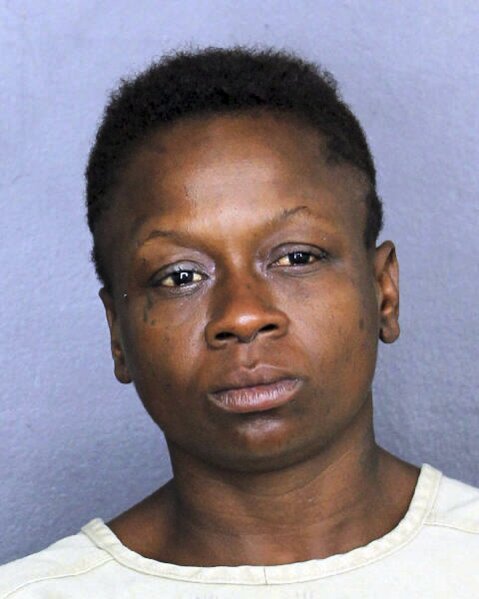 
              In this Nov. 25, 2018 photo, Shenetta Yvette Wilson is under arrest. Wilson faces an aggravated assault charge after authorities say she passed gas in line at a Dollar Store in Dania Beach, Fla., and pulled a knife on a man who complained about it. (Broward County Sheriff's Office via AP)
            