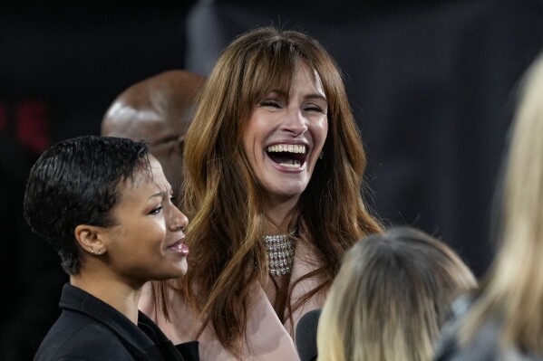 Myha'la Herrold, left, and Julia Roberts are interviewed upon arrival at the screening of the film 'Leave The World Behind' on Wednesday, Nov. 29, 2023 in London. (Scott Garfitt/Invision/AP)