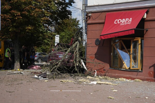 Damage in a street after a Russian attack in Chernihiv, Ukraine, Saturday, Aug. 19, 2023. (AP Photo/Efrem Lukatsky)