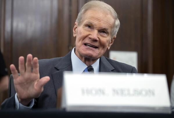 FILE - In this Wednesday, April 21, 2021 file photo, former U.S. Sen. Bill Nelson, nominee for administrator of NASA, speaks during a Senate Committee on Commerce, Science, and Transportation confirmation hearing, on Capitol Hill in Washington.  In his first news interview since becoming NASA's top official this week, Nelson told The Associated Press on Friday, May 7 that measuring the climate and diversifying the workforce are top issues. Nelson hedged on whether the U.S. can put astronauts on the moon by 2024.  (Saul Loeb/Pool via AP)