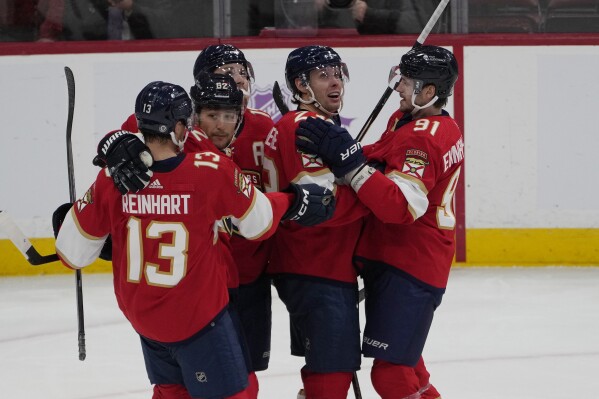 Florida Panthers center Carter Verhaeghe (23) looks up after scoring a goal during the first period of an NHL hockey game against the Edmonton Oilers, Monday, Nov. 20, 2023, in Sunrise, Fla. (AP Photo/Marta Lavandier)