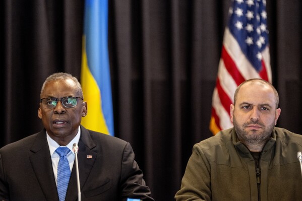 US Defense Secretary Lloyd Austin, left, flanked by Ukrainian Defence Minister Rustem Umerov, speaks at the beginning of the meeting of the 'Ukraine Defense Contact Group' at Ramstein Air Base in Ramstein, Germany, Tuesday, March 19, 2024. Austin vowed Tuesday that the U.S. will continue to support Ukraine's war effort against Russia, even as the U.S. Congress remains stalled over funding to send additional weapons to the front. (AP Photo/Michael Probst)
