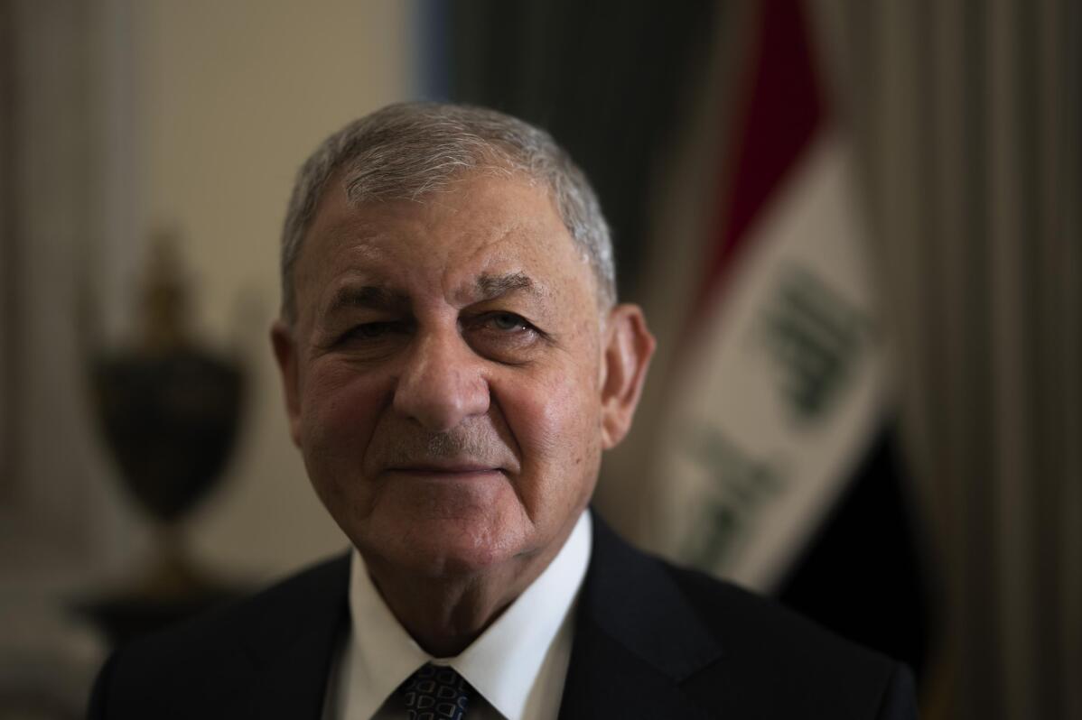 Iraqi president says country now peaceful, life is returning AP News