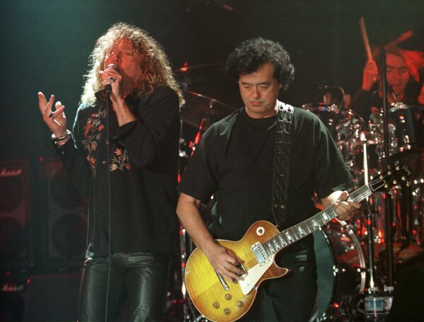 
              FILE--In this March 5, 1998, file photo, Led Zeppelin's Robert Plant, left, performs with guitarist Jimmy Page during their concert in Istanbul. A U.S. appeals court on Friday, Sept. 28, 2018, ordered a new trial in a lawsuit accusing Led Zeppelin of copying an obscure 1960s instrumental for the intro to its classic 1971 rock anthem "Stairway to Heaven."  (AP Photo/Murad Sezer, File)
            